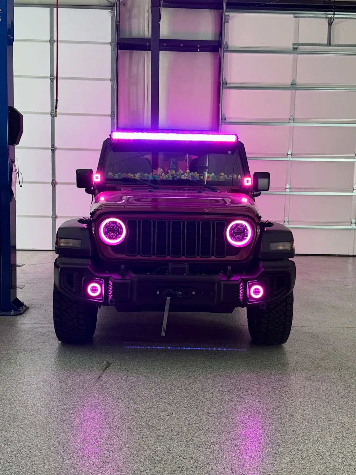 Jeep with bright custom pink lighting