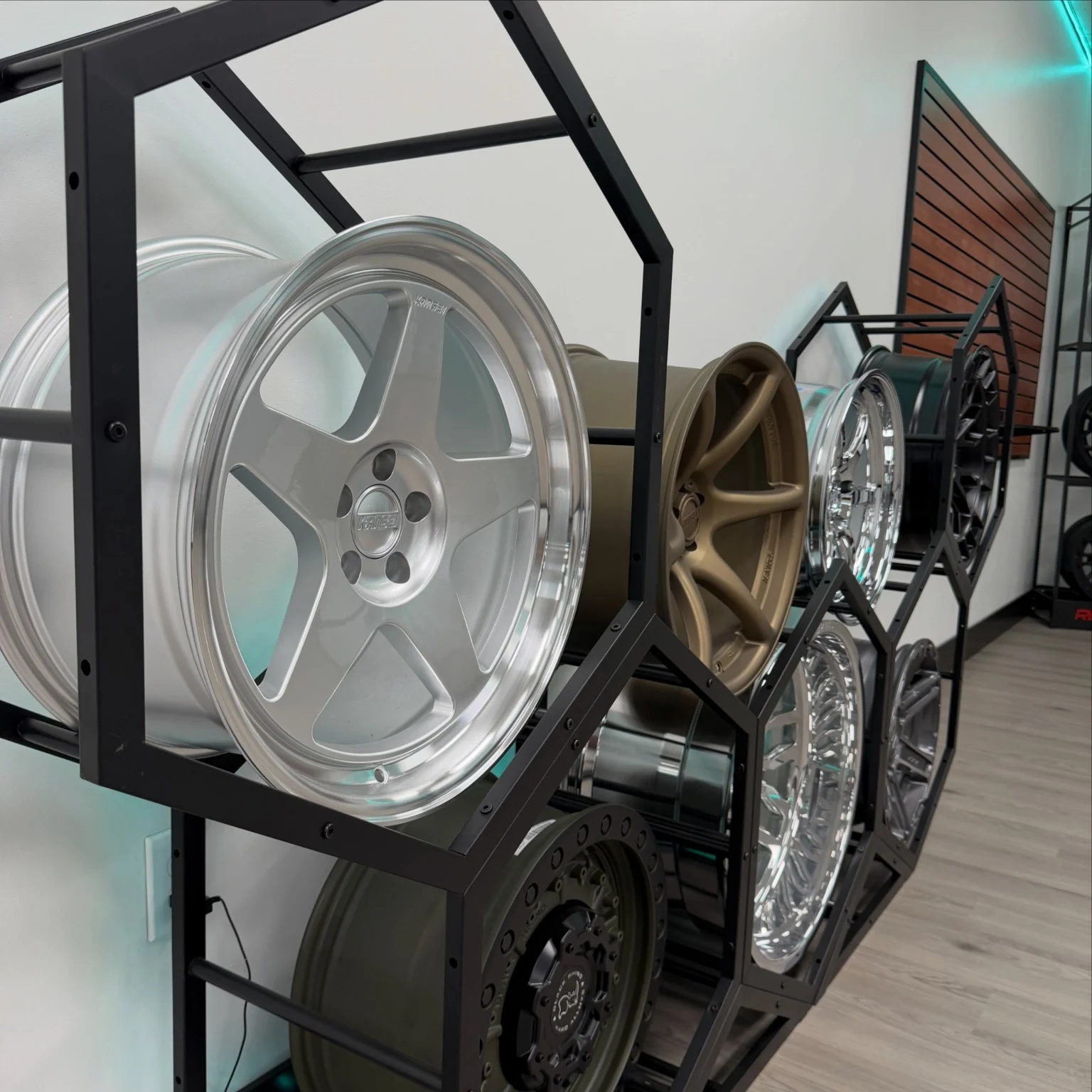 Display of aftermarket wheels in the LUX Motorsports showroom